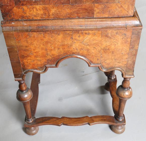TooveysA George I and later burr walnut chest-on-stand with overall feather