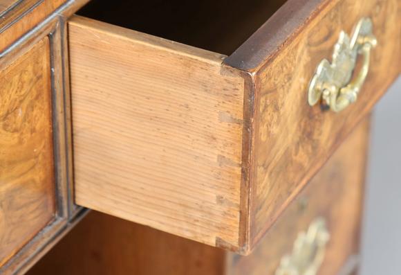 TooveysA 20th century George I style walnut kneehole desk with overall feat