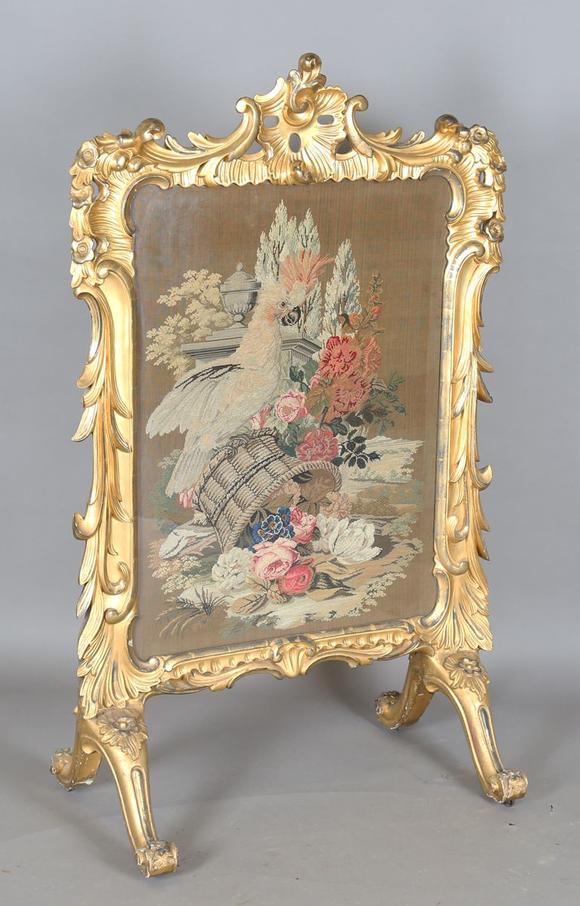 TooveysAn impressive mid-Victorian giltwood firescreen, the rococo style fr