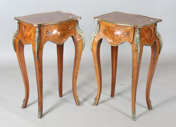 TooveysA pair of 20th century French mahogany bedside tables of shaped bomb