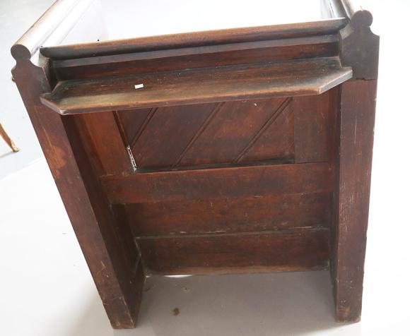 TooveysA late Victorian pitch pine cut-down pew with arched panel ends, hei