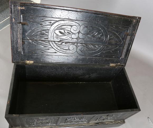 TooveysA late Victorian oak coffer with carved figural scenes to front, hei