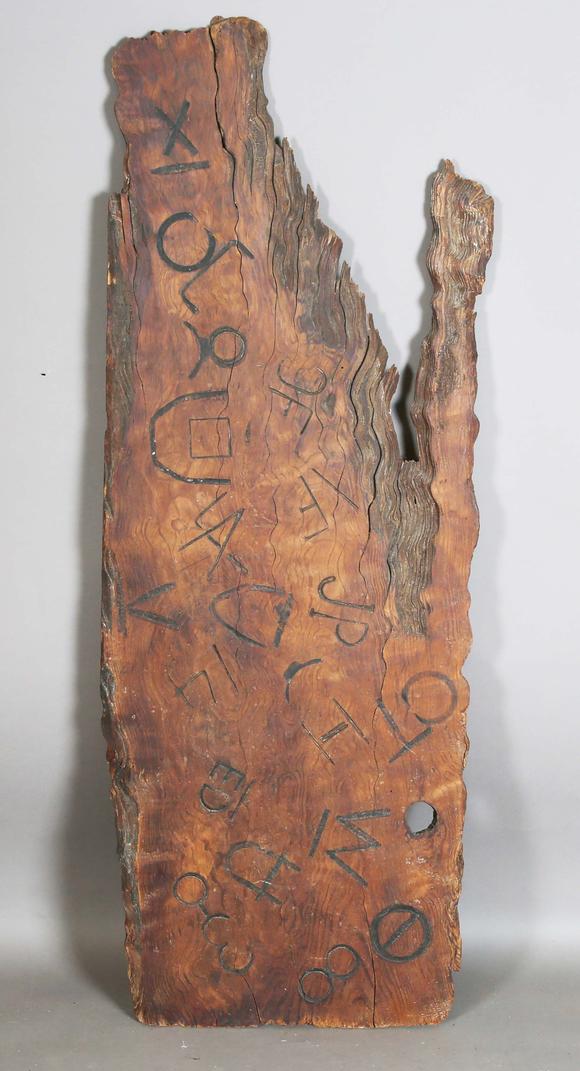 TooveysAn unusual wooden panel, covered in various incised letters and symb