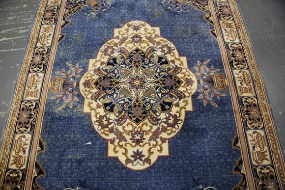 TooveysA Chinese carpet, late 20th century, the blue field with a floral me