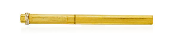 Piguet - H?tel des VentesCartier, un stylo bille en métal doré