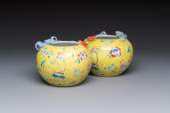Rob Michiels AuctionsA pair of Chinese famille rose yellow-ground water pots with floral design and applied chilong and bats, Qianlong mark, 19/20th C.