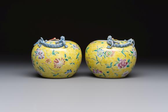 Rob Michiels AuctionsA pair of Chinese famille rose yellow-ground water pots with floral design and applied chilong and bats, Qianlong mark, 19/20th C.