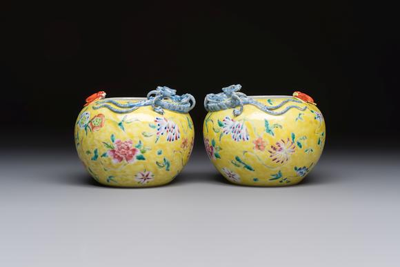 Rob Michiels AuctionsA pair of Chinese famille rose yellow-ground water pots with floral design and applied chilong and bats, Qianlong mark, 19/20th C.