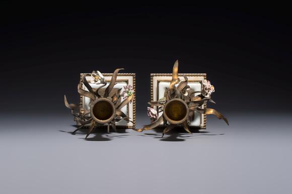 Rob Michiels AuctionsA pair of gilt silver and metal candlesticks with Chinese porcelain, European porcelain flowers, and marble bases, marked Boin-Taburet, late 19th C.