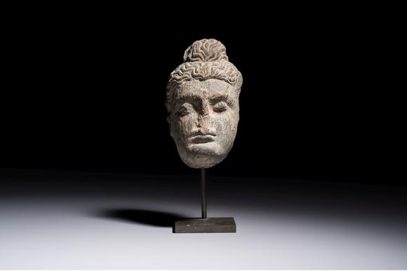 Rob Michiels AuctionsA Gandhara grey schist relief fragment of a Bodhisattva head, 3rd/4th C.
