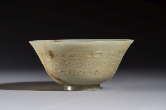 Rob Michiels AuctionsA Tibetan ritual jade bowl with a red coral-mounted silver cover and a stand, 19th C.