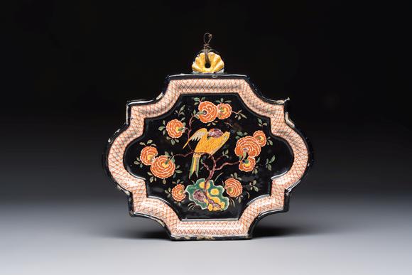 Rob Michiels AuctionsAn exceedingly rare polychrome black-ground Dutch Delft plaque with a parrot, 18th C.