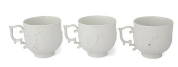 Lot 21 A SET OF THREE MEISSEN PORCELAIN BLANC DE CHINE TEA CUPS