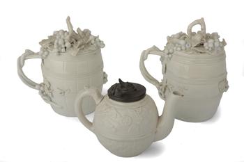 Lot 22 A PAIR OF BLANC DE CHINE MUGS AND COVERS
