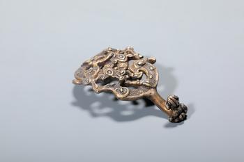 A Gilt Bronze Openwork Dragon Belt Hook, China, 3rd–2nd centuries BCE