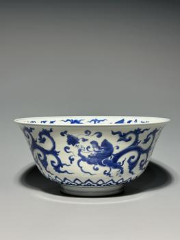 A Blue and White Porcelain Bowl with Intertwined Dragon Scrolls, China, 17th century