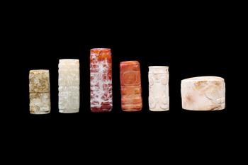 A Group of Six Calcified & Reddish Jade Cong-Style Beads, Liangzhu, Circa 3300–2300 C BC Pr.