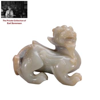 A CHINESE CARVED JADE MYTHICAL BEAST