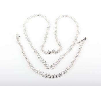 A white gold and colourless cubic zirconia demi-parure, comprising a graduated necklace and bracelet, each mounted with circular cut colourless cubic