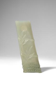 Qing Dynasty, Ca. AD 1644 - 1912. >
A carved celadon jade brush rest in the form of a naturalisti