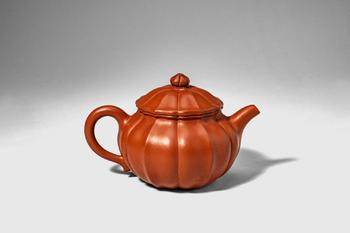 Qing Dynasty, Ca. AD 1644 - 1912. >
A teapot of a lobed form, the body divided into evenly spaced