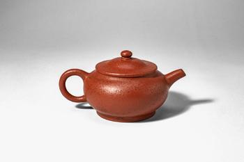 Qing Dynasty, Ca. AD 1644 - 1912. >
A teapot of a compressed globular form, the rounded body rais