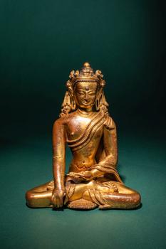 Ca. 15th century AD. >
A finely cast and richly gilded copper alloy figure of the Crowned Buddha