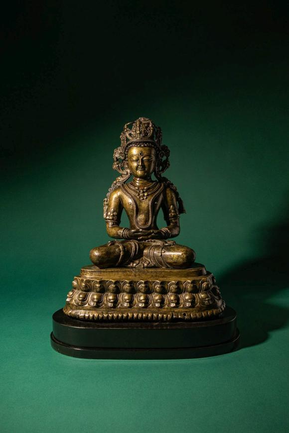 Apollo Art AuctionsCa. 14th century AD. >
A finely cast copper alloy figure depicting Kunzang Akor, seated in serene