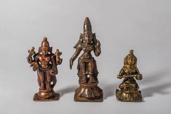 Ca. 18th-19th century AD. A refined group of three South Indian bronze figures depicting Vishnu,