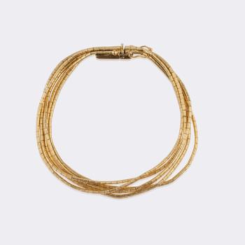 Multi-row vintage gold bracelet.