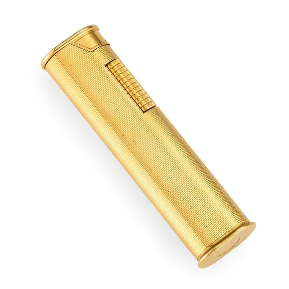 RoseberysDunhill. A gold plated lighter, with engine turned pattern finish, signed, length 7.3cm