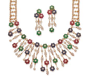 A gem-set floral necklace and earring set, the fringe necklace composed of graduated drops, each with floral cluster panels, set with a brilliant-cut