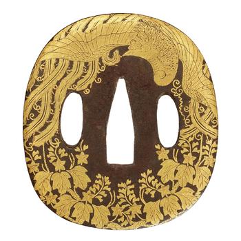 A gold nunome iron tsuba. 18/19th century