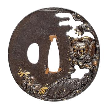 An iron tsuba. 19th century