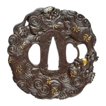 An iron tsuba. 19th century