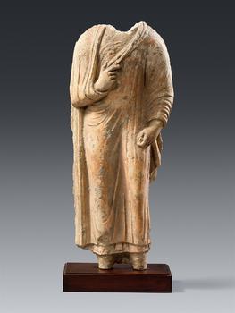A rare Gandharan stucco fragment of standing Buddha Shakyamuni. Pakistan. Around 4th century