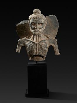 A Gandharan grey schist bust of Emaciated Buddha. Pakistan, Gandhara. Kushan period, 2nd/3rd century
