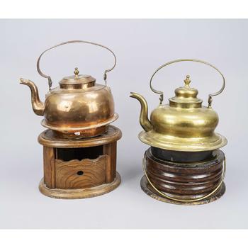 2 large teapots on a wooden tea war