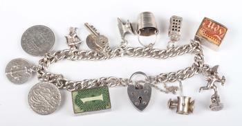 A silver curblink charm bracelet on a silver heart shaped padlock cl