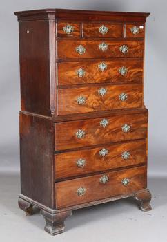 A George III mahogany secrétaire chest-on-chest, fitted with nine oa