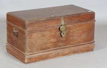 A 20th century Burmese hardwood trunk, the hinged lid inset with arc
