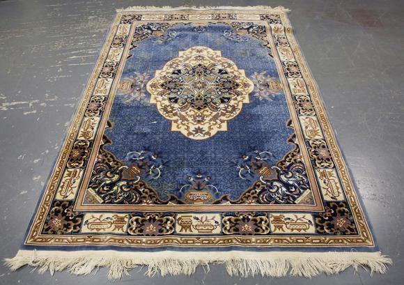TooveysA Chinese carpet, late 20th century, the blue field with a floral me