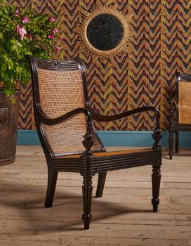 Y A CLOSELY MATCHED PAIR OF CEYLONESE CARVED EBONY ARMCHAIRS, FIRST HALD 19TH CENTURY