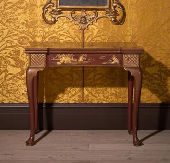 A FINE GEORGE II SCARLET LACQUER AND GILT JAPANNED FOLDING CARD TABLE, CIRCA 1730