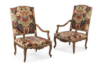 A PAIR OF CARVED WALNUT AND NEEDLEWORK UPHOLSTERED FAUTEUILS, IN REGENCE STYLE, 19TH CENTURY
