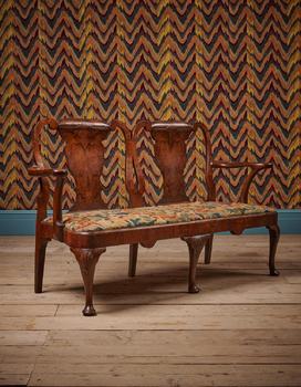 A GEORGE II WALNUT SETTEE, CIRCA 1735