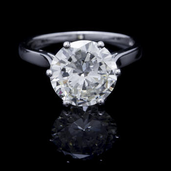 Bucherer, solitaire or gris 750 serti d'un diamant taille brillant