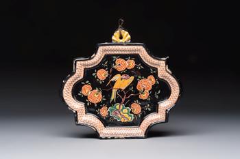 An exceedingly rare polychrome black-ground Dutch Delft plaque with a parrot, 18th C.