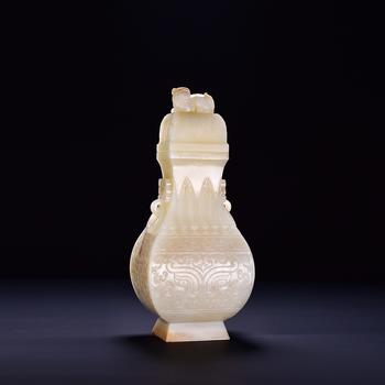 白玉饕餮紋鋪首獅鈕蓋瓶