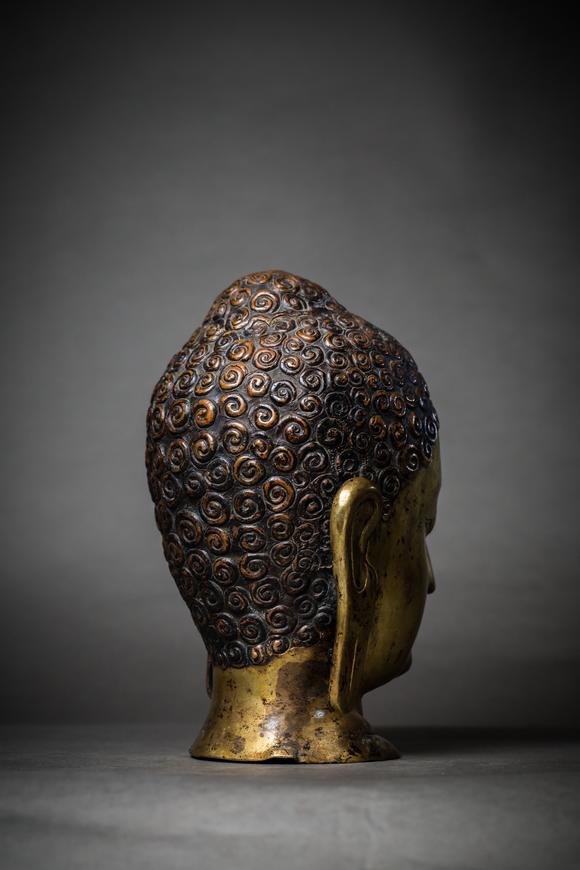 a gilt bronze buddha head